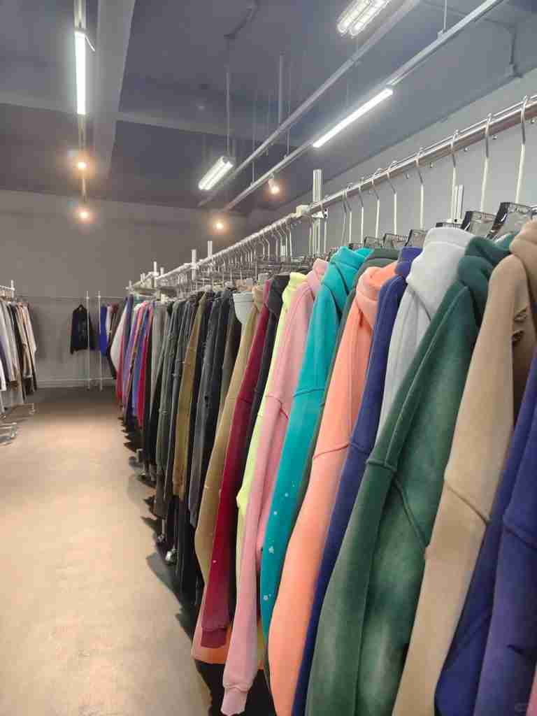 Custom hoodie fabric showroom with multiple streetwear color options